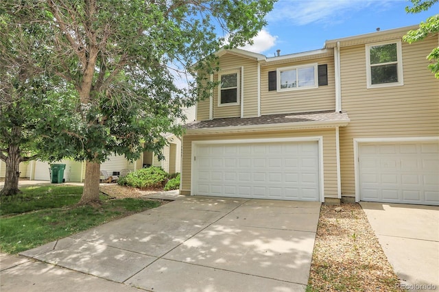 7977 S Kittredge St, Englewood, CO 80112 - view of front of home with an attached garage and concrete driveway