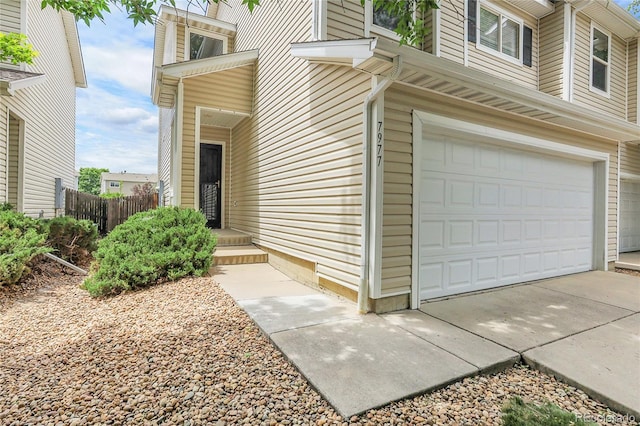 7977 S Kittredge St, Englewood, CO 80112 - view of exterior entry featuring an attached garage