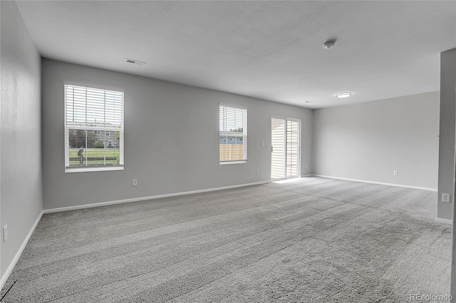 7977 S Kittredge St, Englewood, CO 80112 - spare room with a smoke detector and carpet flooring