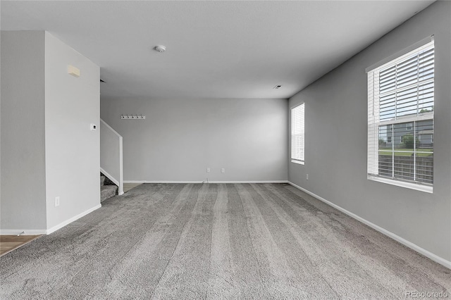 7977 S Kittredge St, Englewood, CO 80112 - unfurnished living room featuring stairway and carpet floors