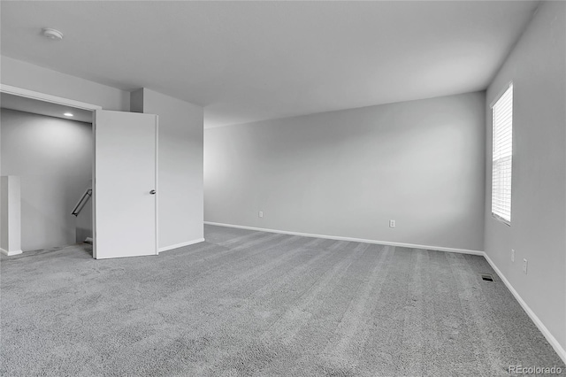7977 S Kittredge St, Englewood, CO 80112 - carpeted spare room featuring a smoke detector and plenty of natural light