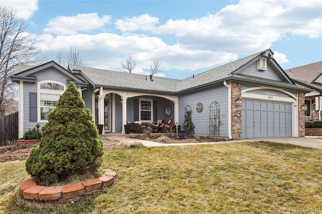 ranch-style home featuring brick siding, concrete driveway, a front yard, covered porch, and a garage