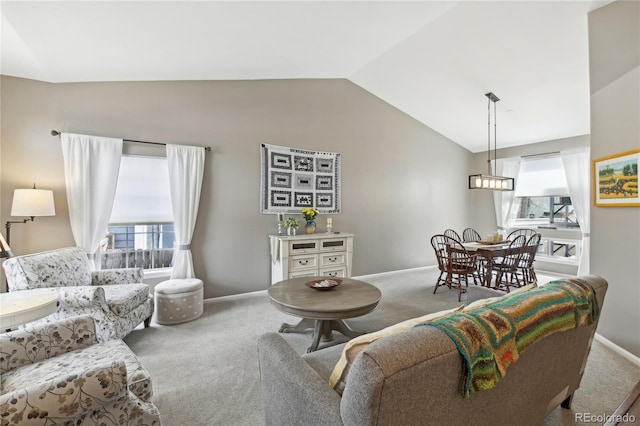 living room with baseboards, carpet flooring, and vaulted ceiling