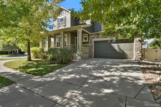 view of front facade featuring a garage and covered porch