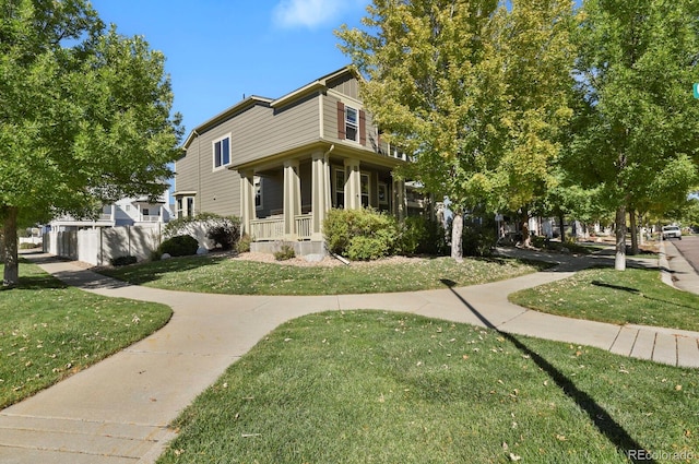 view of front of property with a front yard and a porch