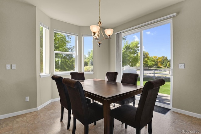 dining area with an inviting chandelier and a healthy amount of sunlight