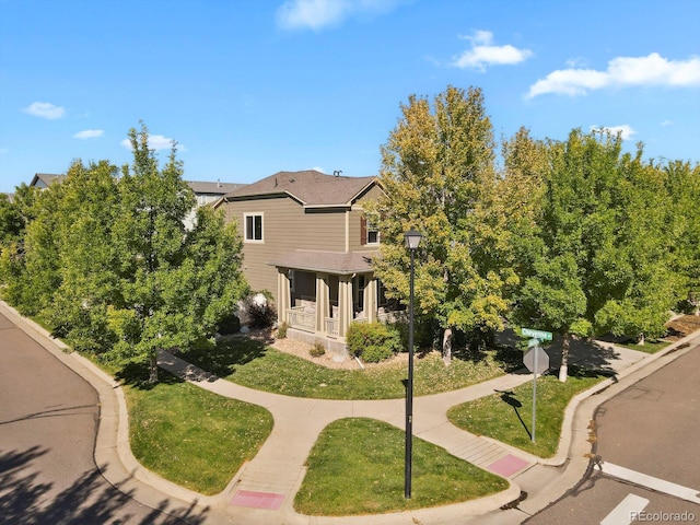 view of front of property with a front lawn and covered porch