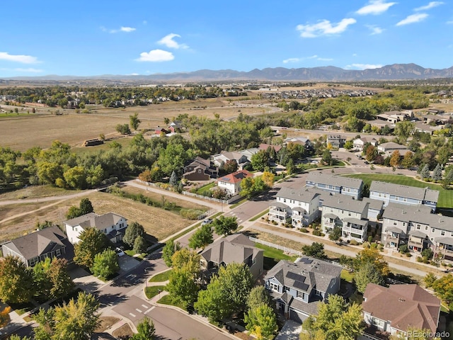 birds eye view of property featuring a mountain view