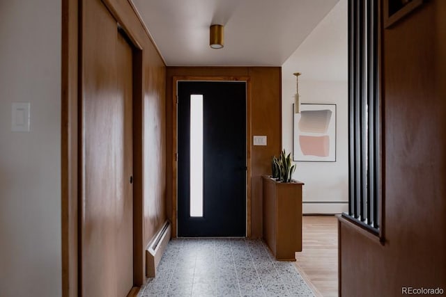 3400 Moore St, Wheat Ridge, CO 80033 - entrance foyer featuring a baseboard heating unit and light floors