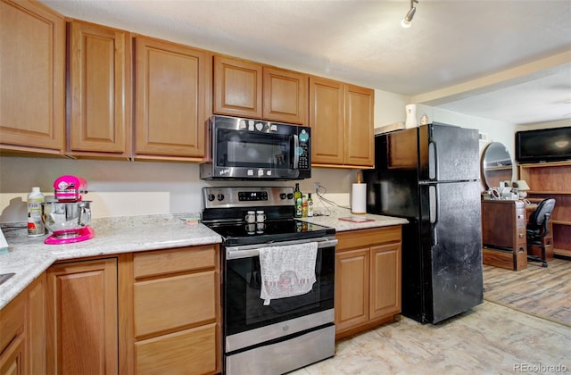 2615 Lambert Ave, Pueblo, CO 81003 - kitchen with black appliances