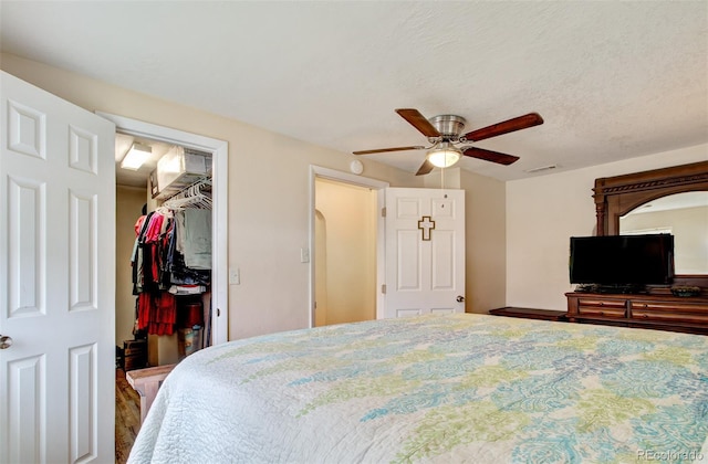 2615 Lambert Ave, Pueblo, CO 81003 - bedroom with a walk in closet, a closet, and a ceiling fan