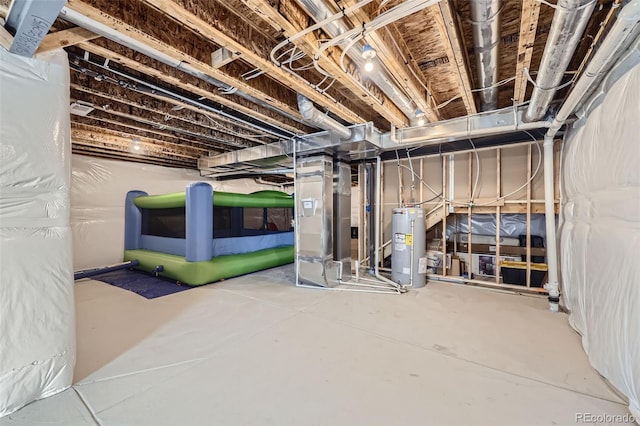 unfinished basement featuring water heater