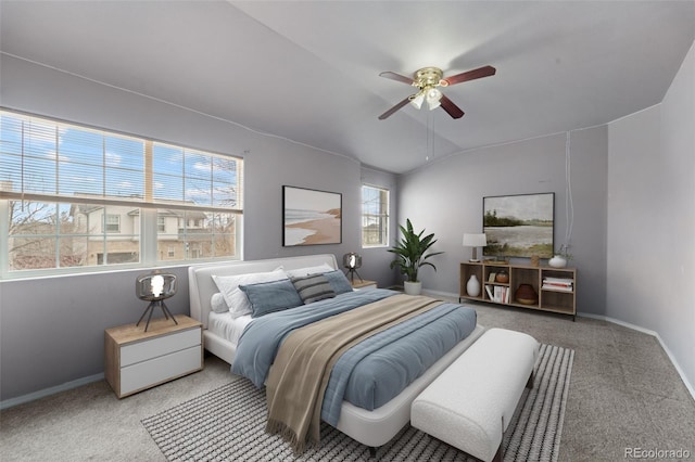 carpeted bedroom featuring baseboards, a ceiling fan, and vaulted ceiling