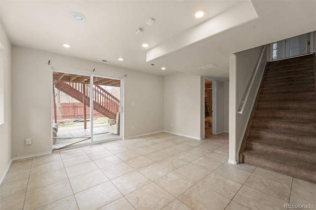 empty room featuring recessed lighting, stairway, baseboards, and light tile patterned floors