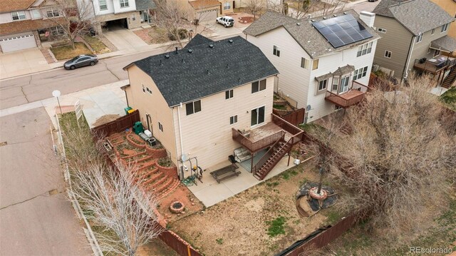birds eye view of property with a residential view