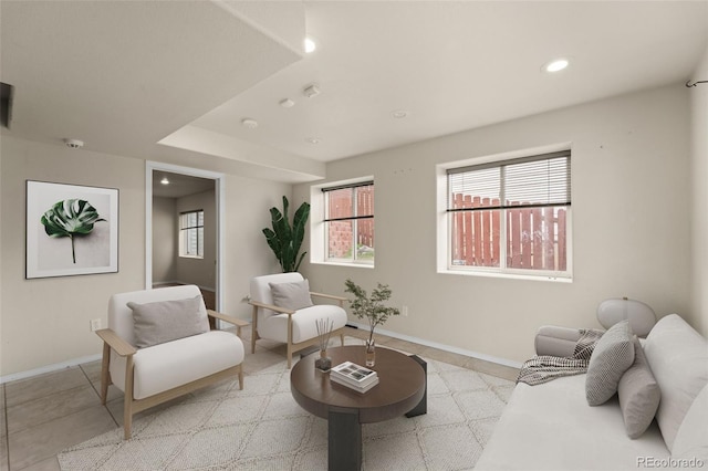living room featuring recessed lighting, light tile patterned floors, and baseboards