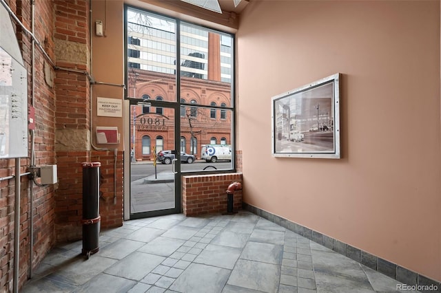 interior space featuring brick wall