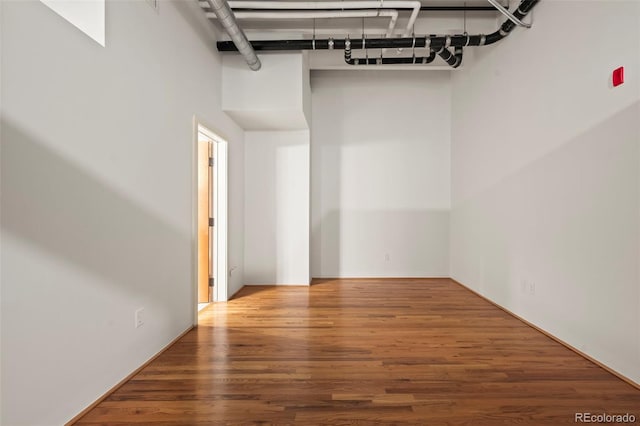 spare room with wood-type flooring