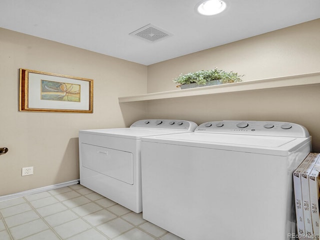 laundry room with washing machine and dryer