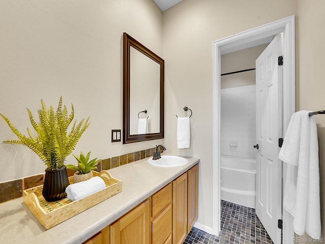 bathroom featuring tile patterned flooring, vanity, and bathtub / shower combination