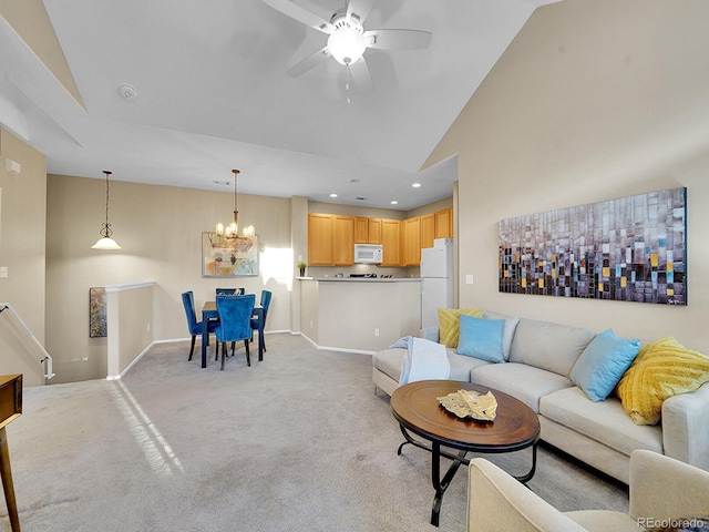 living room featuring light carpet, ceiling fan with notable chandelier, and high vaulted ceiling