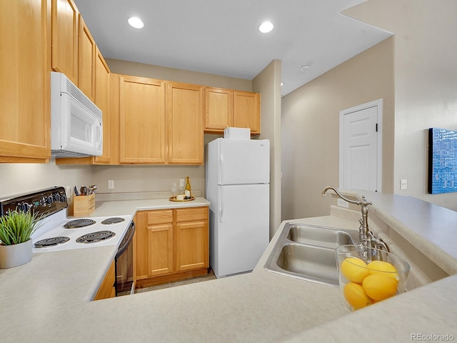 kitchen with sink, white appliances, and light brown cabinets