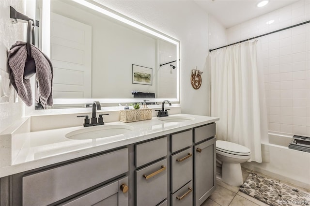 full bathroom featuring tile patterned floors, shower / bath combo, toilet, and vanity