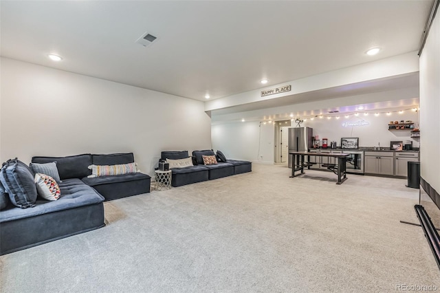 living room featuring bar and light colored carpet