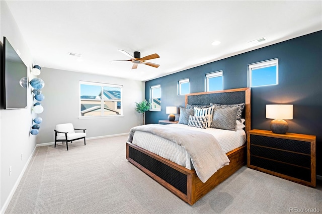 bedroom featuring ceiling fan and light colored carpet