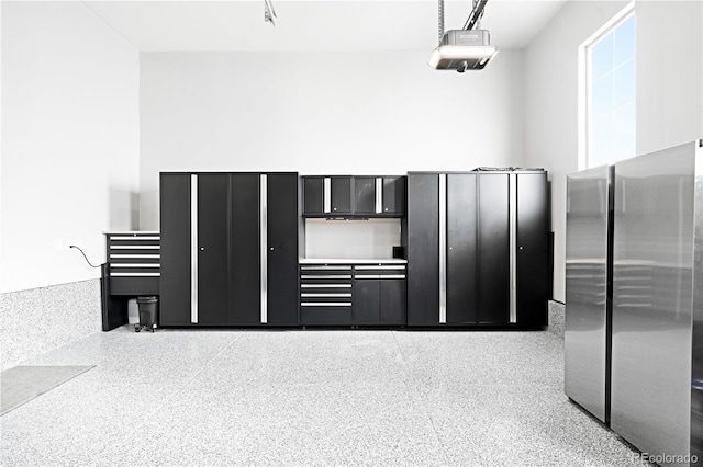 kitchen featuring decorative light fixtures and stainless steel fridge