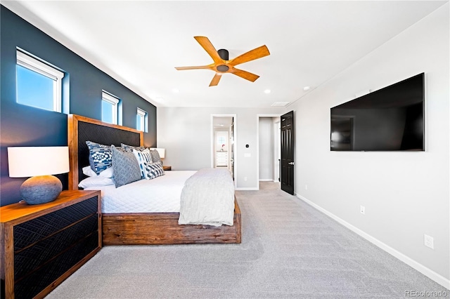 bedroom featuring ceiling fan and light carpet