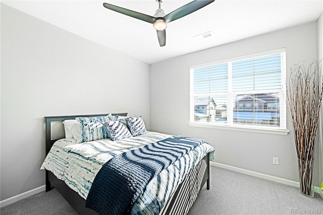 bedroom with light carpet and ceiling fan