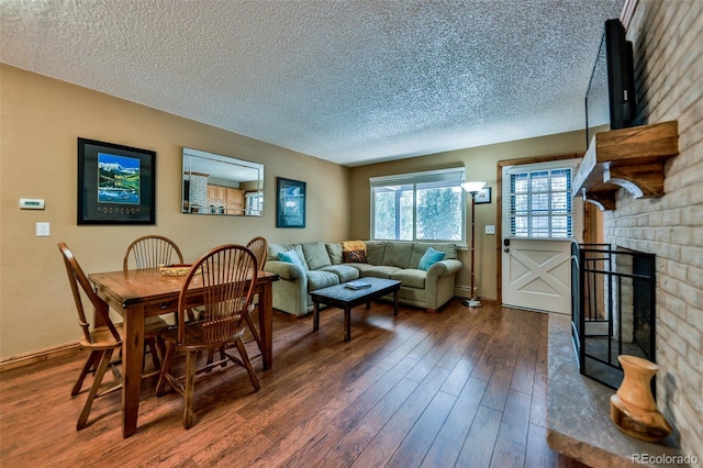 dining room featuring dark hardwood / wood-style floors and a textured ceiling