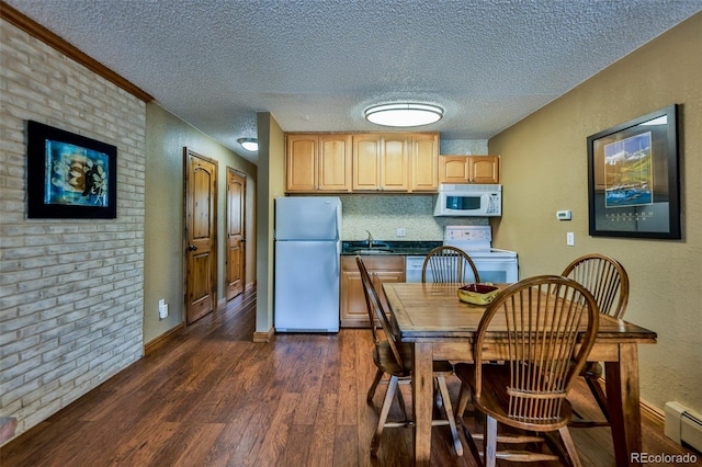 kitchen with light brown cabinetry, white appliances, a baseboard heating unit, a textured ceiling, and dark hardwood / wood-style flooring