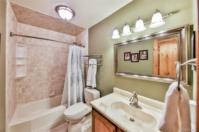 full bathroom with vanity, shower / bath combination with curtain, and toilet