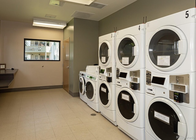 clothes washing area with stacked washing maching and dryer and separate washer and dryer