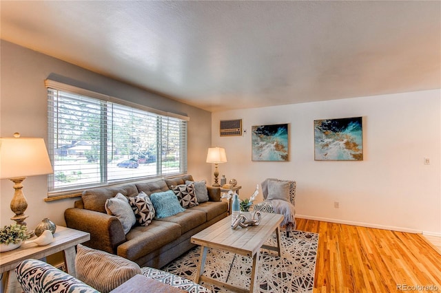 living room with light wood-style flooring and baseboards
