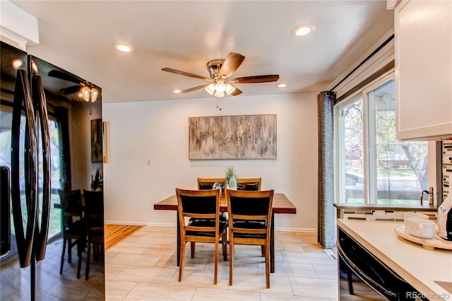 dining room with a ceiling fan, recessed lighting, baseboards, and light tile patterned flooring