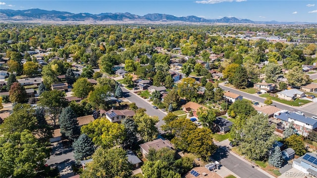 aerial view of residential area featuring mountains