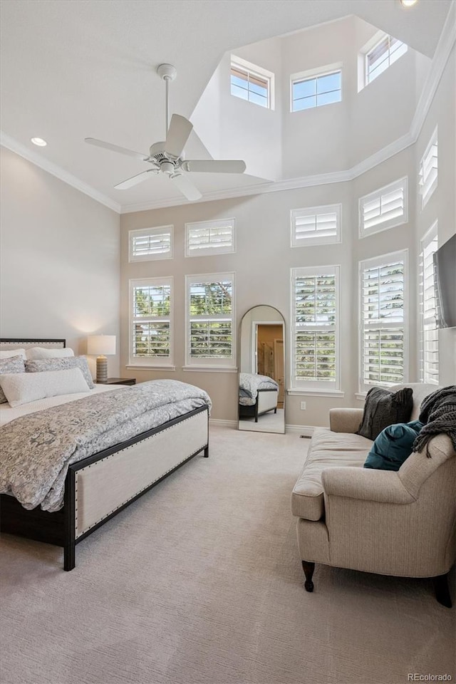 7834 Vallagio Ln, Englewood, CO 80112 - bedroom with carpet floors, a towering ceiling, ceiling fan, and ornamental molding