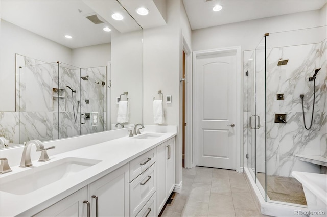7834 Vallagio Ln, Englewood, CO 80112 - bathroom featuring a marble finish shower, double vanity, and recessed lighting