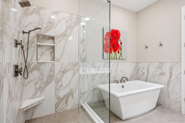 7834 Vallagio Ln, Englewood, CO 80112 - full bath featuring a soaking tub, a marble finish shower, and tile walls