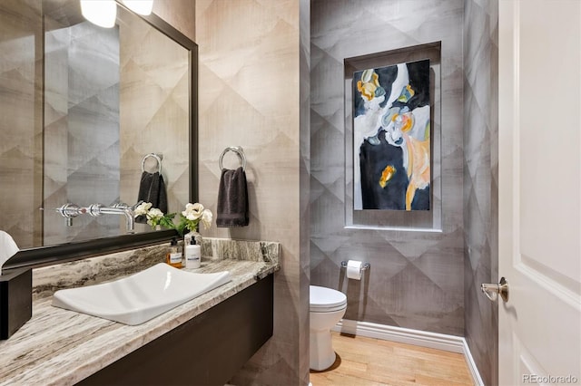 7834 Vallagio Ln, Englewood, CO 80112 - bathroom featuring vanity, wood finished floors, and tile walls