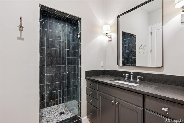7834 Vallagio Ln, Englewood, CO 80112 - full bathroom featuring a shower stall and vanity