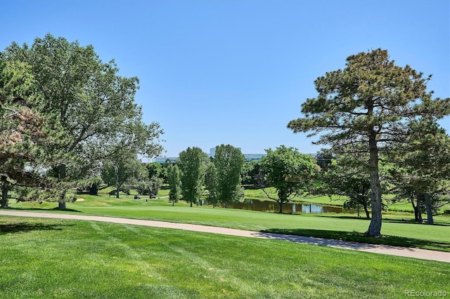 7834 Vallagio Ln, Englewood, CO 80112 - view of community with a lawn and a water view
