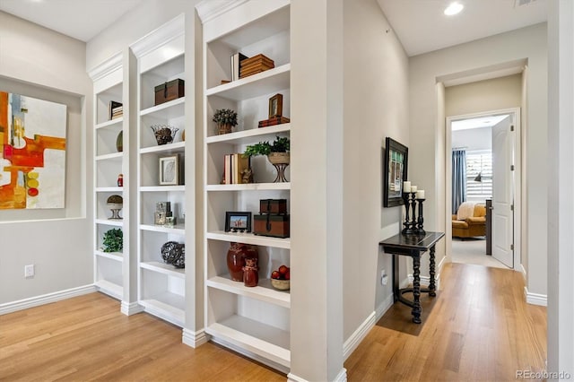 7834 Vallagio Ln, Englewood, CO 80112 - corridor with wood finished floors and baseboards