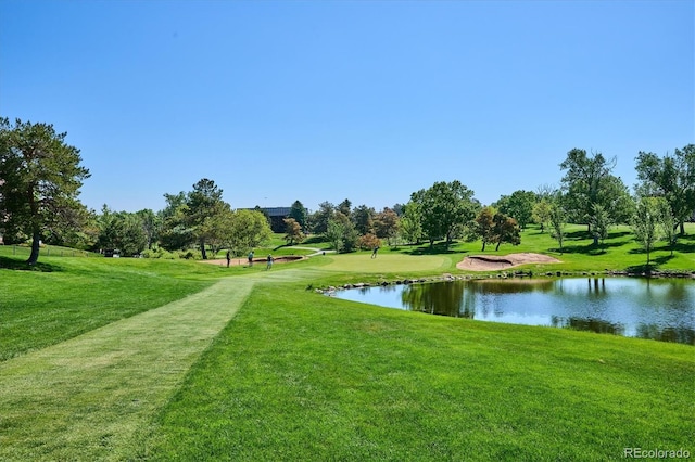 7834 Vallagio Ln, Englewood, CO 80112 - view of community featuring a water view and a lawn