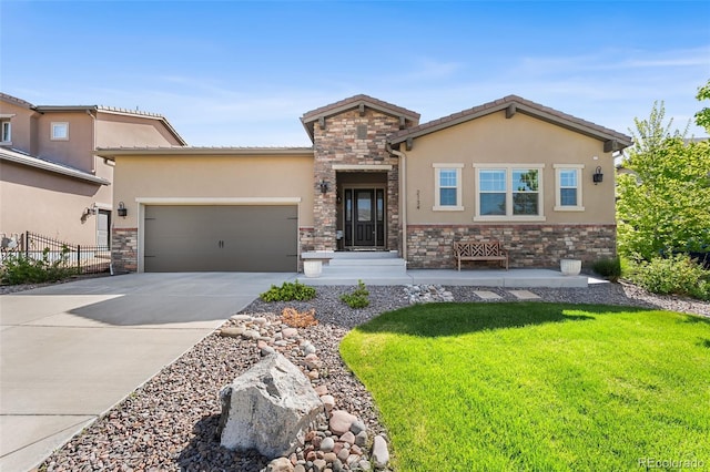 2134 S Poppy St, Lakewood, CO 80228 - view of front of property featuring stone siding, stucco siding, and a garage