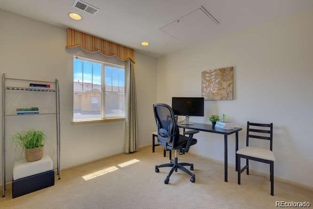 office area with light colored carpet