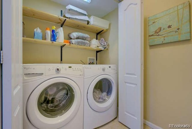 laundry room featuring independent washer and dryer and light tile patterned flooring